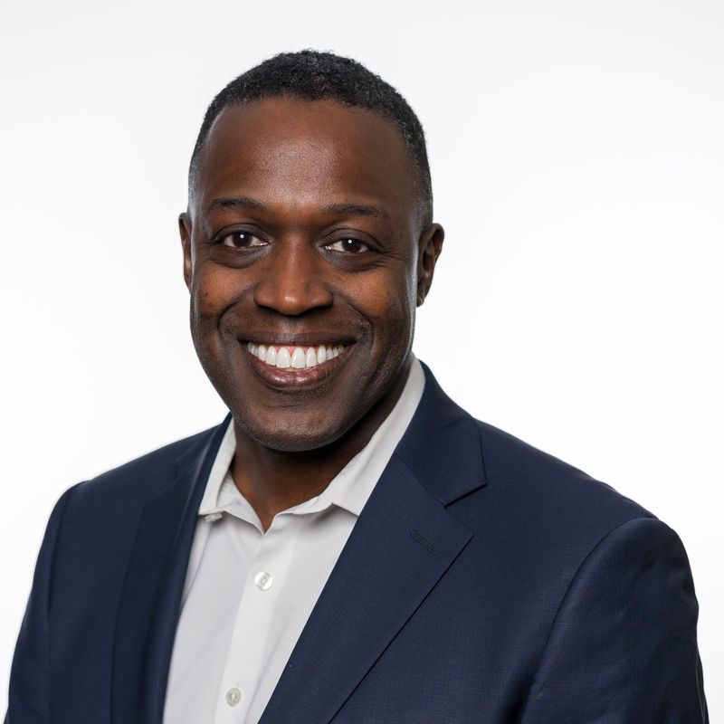 Professional headshot of Bryant Fields, Vice President at Medidata Solutions, smiling in a suit and tie against a neutral background.